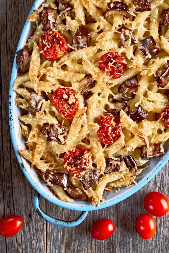 A deliciously cheesy Italian pasta bake, bubbling with melted provolone and mozzarella, served in a baking dish.