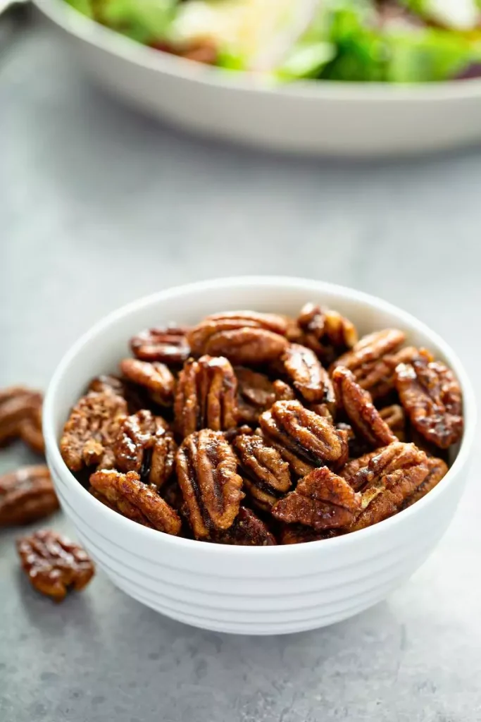 Spiced pecans served in a bowl, ready for snacking