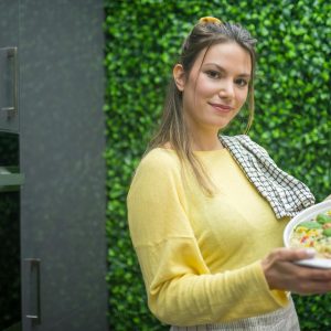 Woman holding Ceramic Bowl with Food