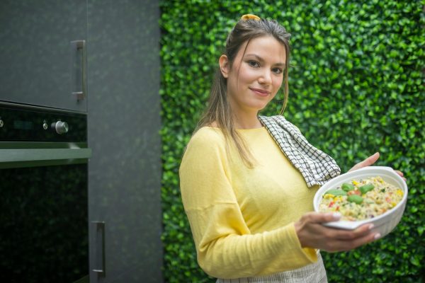 Woman holding Ceramic Bowl with Food