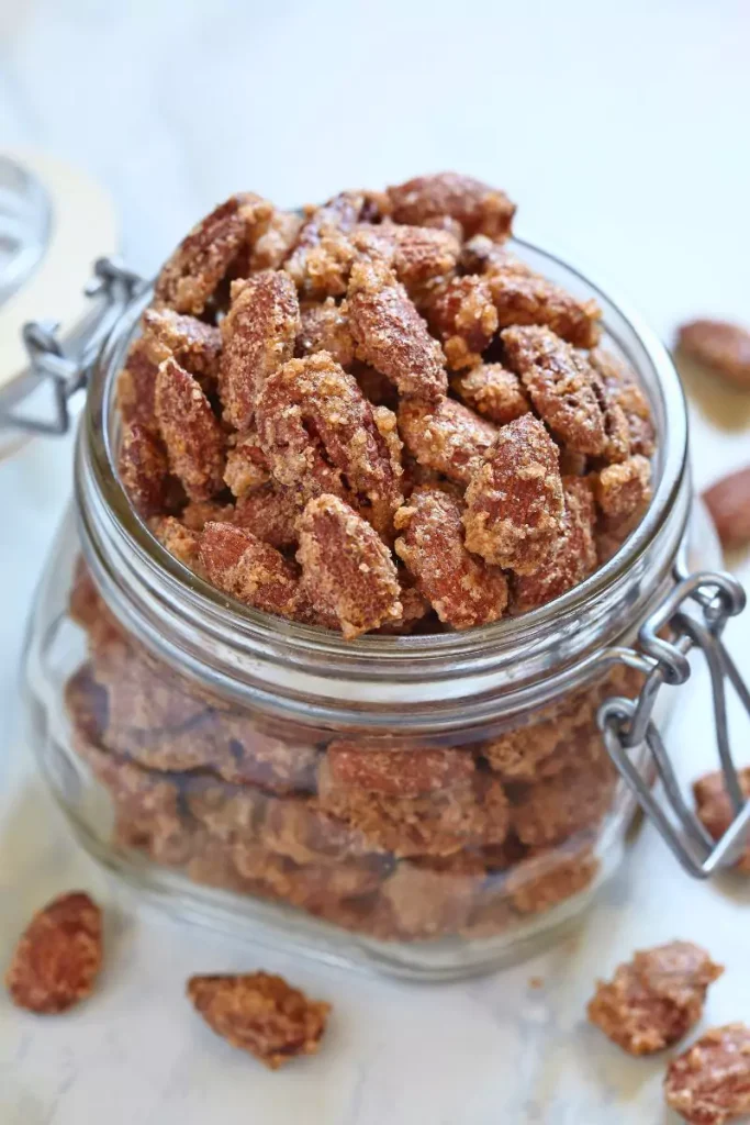 A bowl of sugar-coated pecans