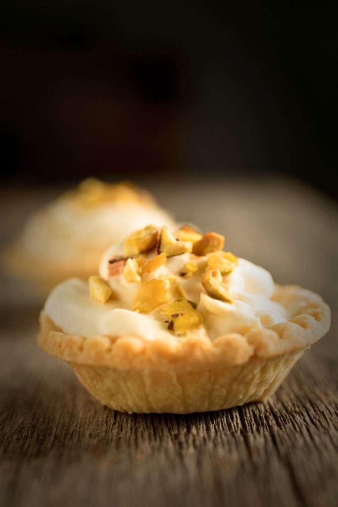 Golden-brown phyllo tartlets filled with a creamy butternut squash and thyme mixture, topped with fresh thyme